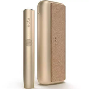 Sleek white IQOS heated tobacco device with holder and charger