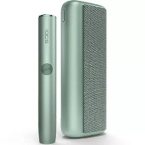Sleek white IQOS heated tobacco device with holder and charger