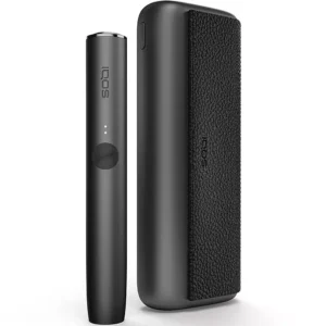 Sleek white IQOS heated tobacco device with holder and charger